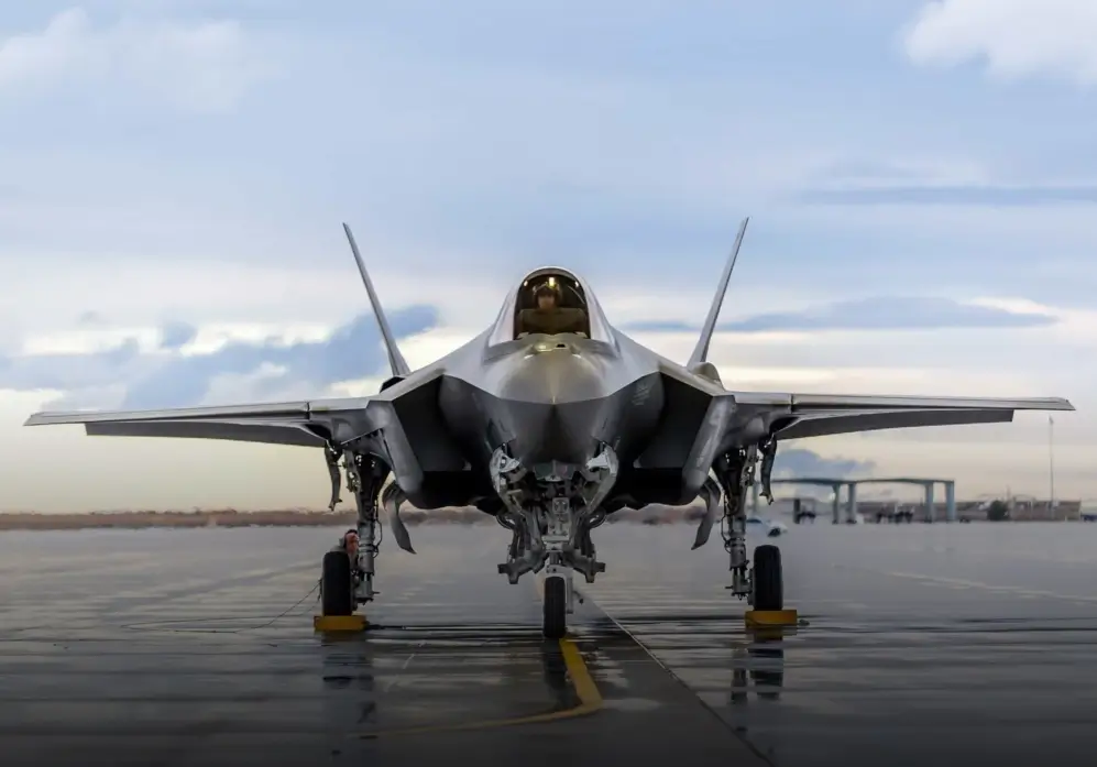 A front view of a fighter jet on a runway, representing advanced aerospace technology and military aviation.